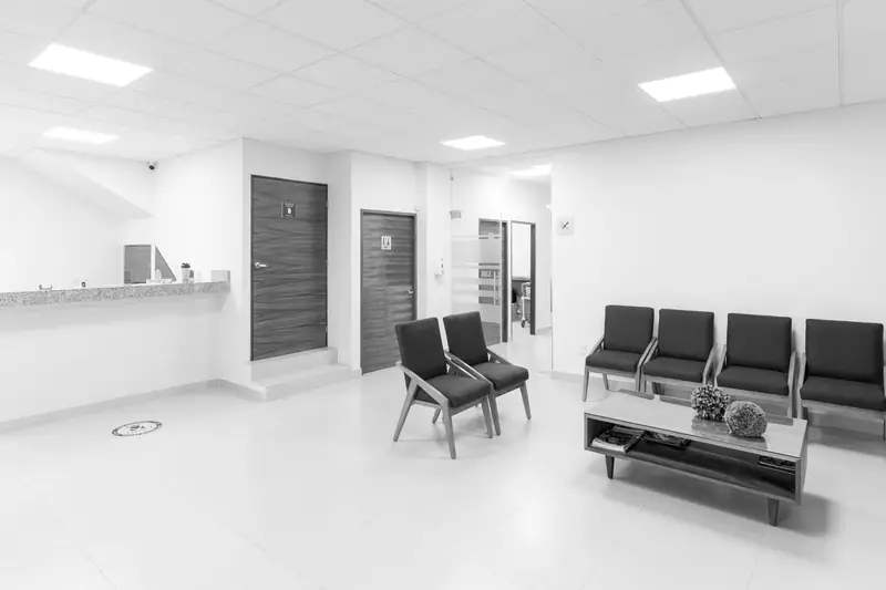 A bright, empty reception and waiting area in a clinic
